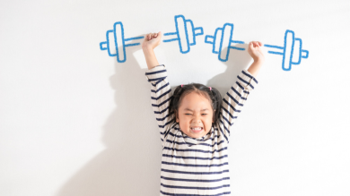 
		a child lifts weights
	